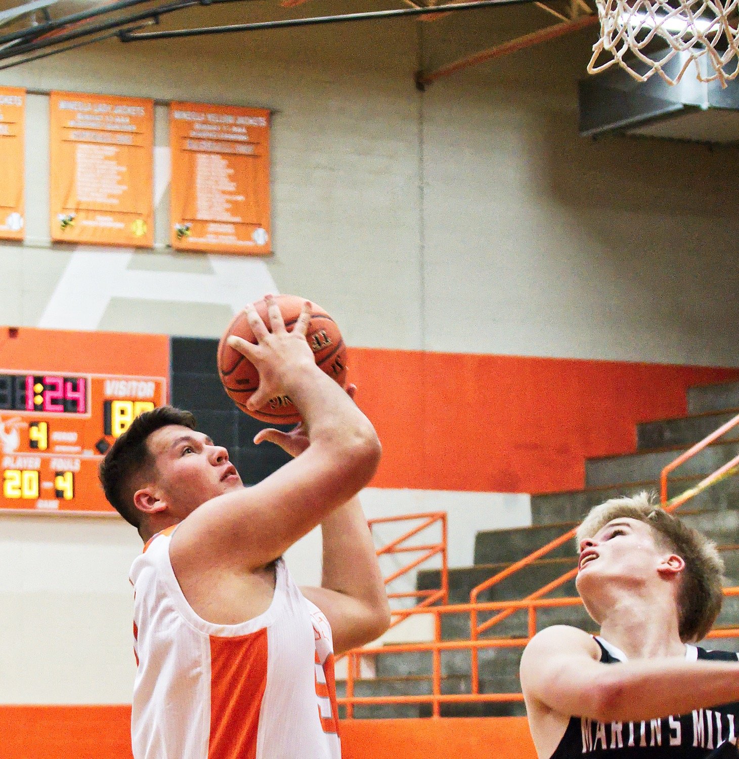 Jackson Anderson joined the basketball squad for his senior year, and his first bucket for the season, coming off a rebound, drew enthusiastic cheers from he Mineola faithful. [more shots here]